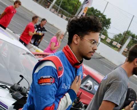 Blake Lothian with hand over heart